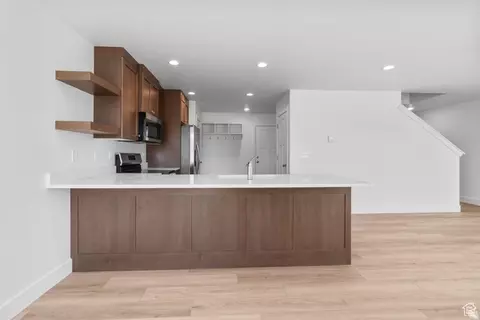 Open kitchen and living area in Loveless Estates townhome for living in Nephi Utah