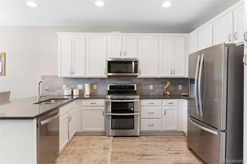 Kitchen - 15388 W 64th Dr #D, Arvada, CO 80007 photo 5 of 7