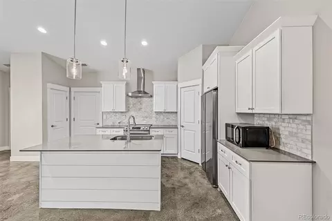 Kitchen - 526 Foxtail Pl, Wiggins, CO 80654 photo 3 of 4
