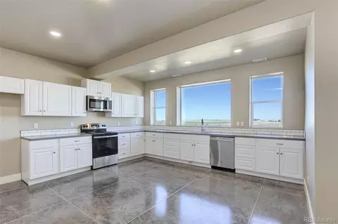Kitchen - 45425 Wolf Creek Dr, Bennett, CO 80102 photo 5 of 5
