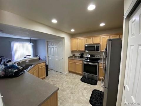 18954 E 57th Pl #E, Denver, CO 80249 photo 1