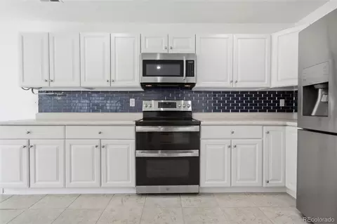 Kitchen - 3897 Lisbon St, Denver, CO 80249 photo 4 of 5