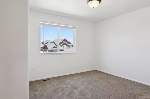 Bedroom - 727 Elk Mountain Dr, Windsor, CO 80550 photo 9 of 10