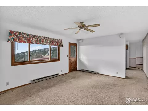 Living - 15655 Mossrock Dr, Longmont, CO 80503 photo 5 of 7