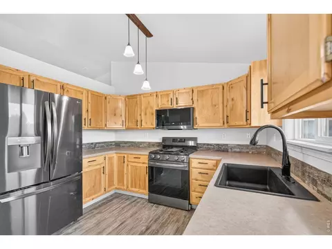 Kitchen - 408 Suzann St, Wiggins, CO 80654 photo 3 of 4