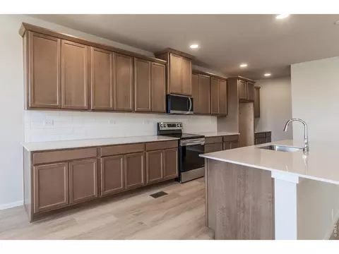 Kitchen - 734 Trumpet Ct, Windsor, CO 80550 photo 5 of 9