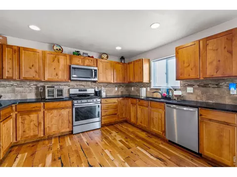 Kitchen - 1114 Cottontail Ln, Wiggins, CO 80654 photo 2 of 4
