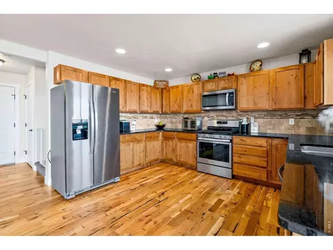 Kitchen - 1114 Cottontail Ln, Wiggins, CO 80654 photo 3 of 4