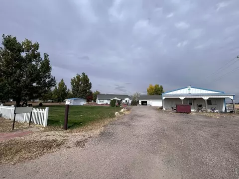 Exterior - 717 3rd Ave, Wiggins, CO 80654 photo 8 of 12