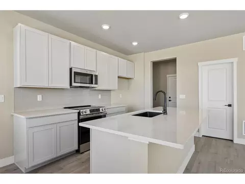 Kitchen - 2143 Silverado Ln, Fort Lupton, CO 80621 photo 2 of 3