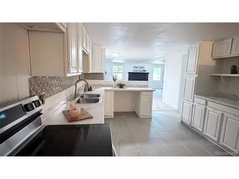 Kitchen - 7486 Patrick St, Fort Lupton, CO 80621 photo 3 of 3