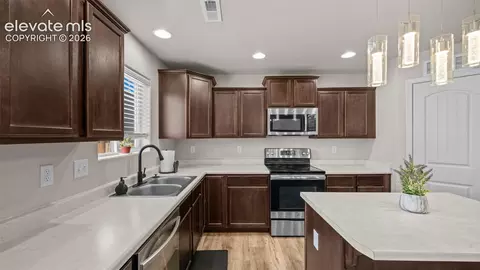 Kitchen - 7714 Cruzer Hts, Peyton, CO 80831 photo 3 of 4