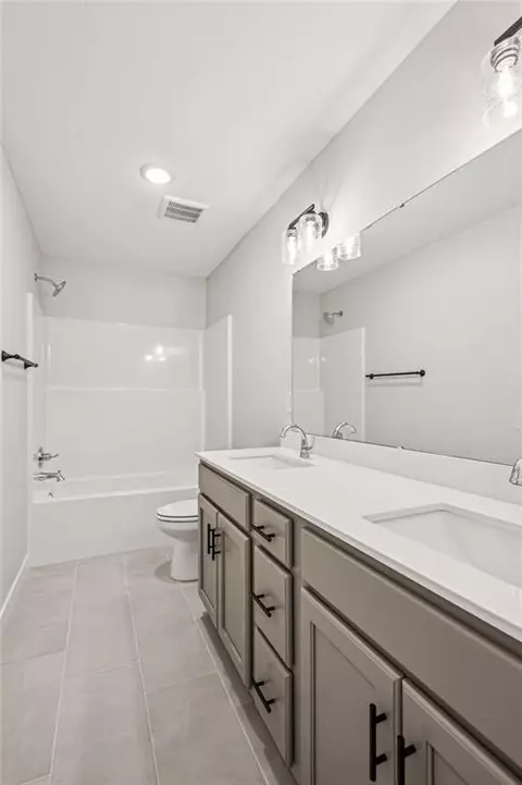 Bath - 838 Reed Dr, Raymore, MO 64083 photo 2 of 3
