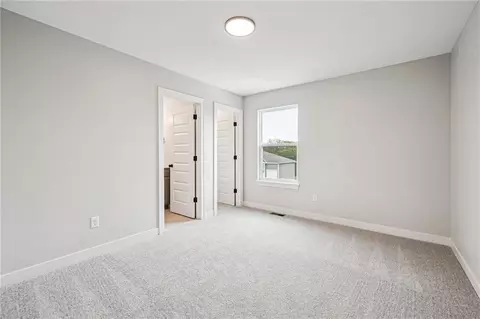 Bedroom - 838 Reed Dr, Raymore, MO 64083 photo 8 of 9