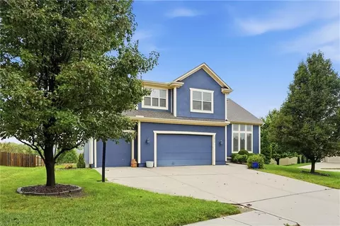 Exterior - 1217 Hampton Dr, Raymore, MO 64083 photo 4 of 12
