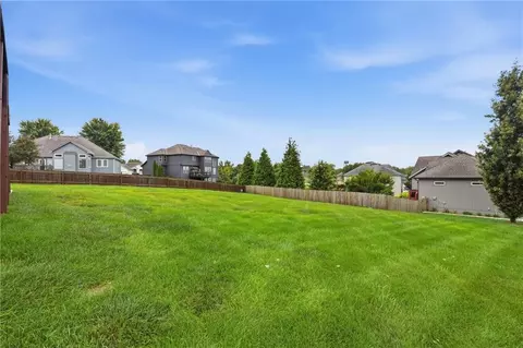 Exterior - 1217 Hampton Dr, Raymore, MO 64083 photo 9 of 12