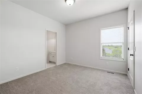 Bedroom - 1217 Hampton Dr, Raymore, MO 64083 photo 8 of 9