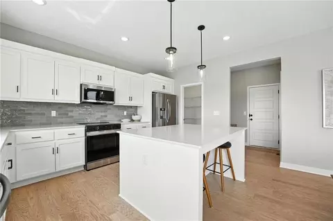 Kitchen - 1201 Sendera Trl, Raymore, MO 64083 photo 3 of 4