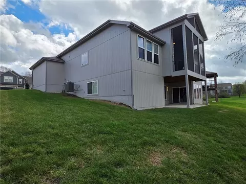 Exterior - 1205 Hampton Dr, Raymore, MO 64083 photo 5 of 8
