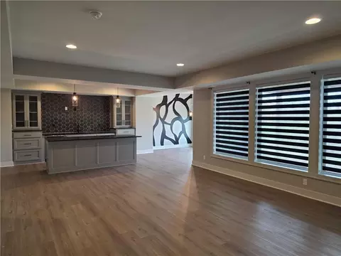 Living - 1205 Hampton Dr, Raymore, MO 64083 photo 3 of 4