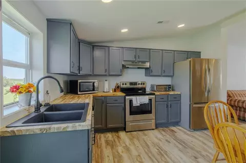 Kitchen - 10064 State Route T Hwy Hwy, Adrian, MO 64720 photo 1 of 2