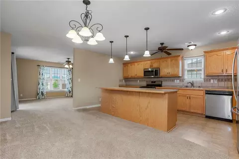 Living - 1102 Bristol Dr, Raymore, MO 64083 photo 4 of 7