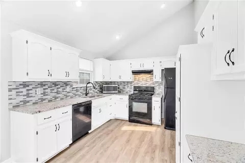 Kitchen - 100 N Darrowby Dr, Raymore, MO 64083 photo 2 of 3