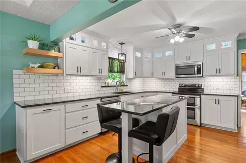 Kitchen - 701 Benjamin Ave, Gower, MO 64454 photo 2 of 3