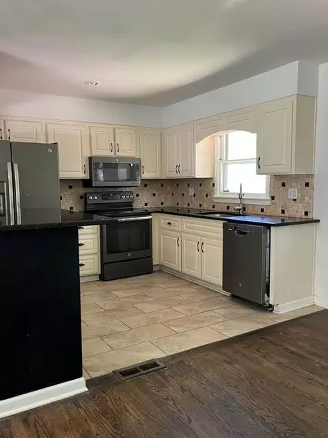 Kitchen - 8958 E 54th St, Raytown, MO 64133 photo 1 of 4