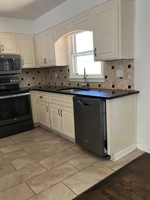 Kitchen - 8958 E 54th St, Raytown, MO 64133 photo 2 of 4