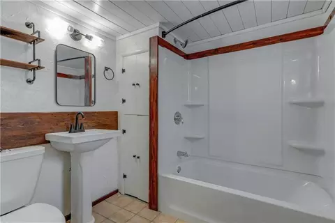 Bath - 300 W 3rd St, Freeman, MO 64746 photo 1 of 2
