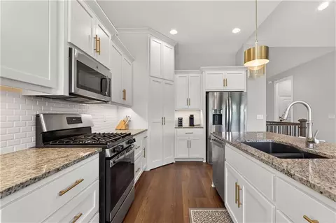 Kitchen - 1540 SW Cornwall Rd, Raymore, MO 64083 photo 2 of 4