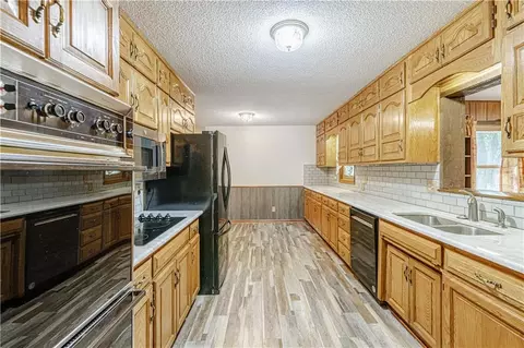Kitchen - 700 S Alexander Rd, Independence, MO 64056 photo 2 of 4