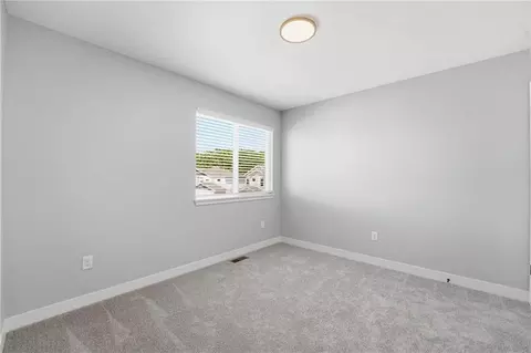 Bedroom - 707 Glenn Cir, Raymore, MO 64083 photo 9 of 10