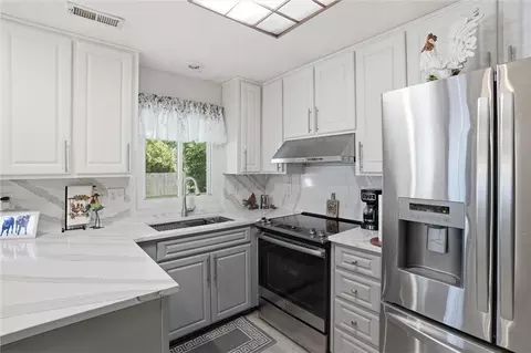 Kitchen - 204 N Walker Dr, Raymore, MO 64083 photo 6 of 6