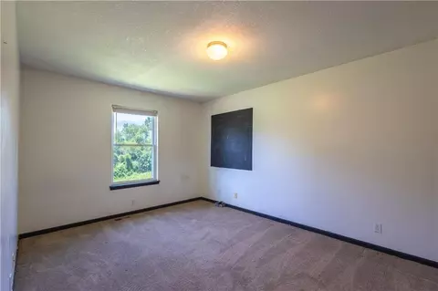 Bedroom - 722 Garnes St, Raymore, MO 64083 photo 2 of 5