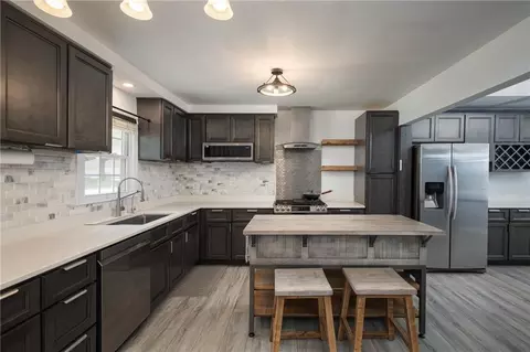 Kitchen - 404 S Sunset Ln, Raymore, MO 64083 photo 3 of 4