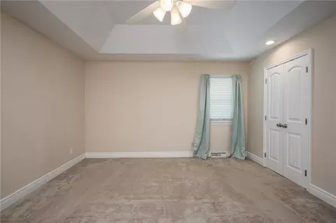 Bedroom - 404 S Sunset Ln, Raymore, MO 64083 photo 2 of 7