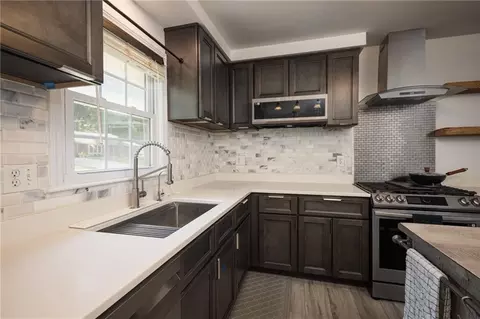 Kitchen - 404 S Sunset Ln, Raymore, MO 64083 photo 2 of 4
