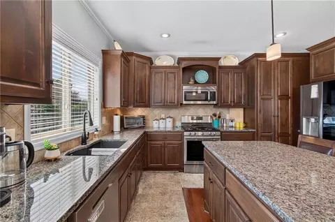 Kitchen - 420 Meadowlark Dr, Raymore, MO 64083 photo 2 of 4