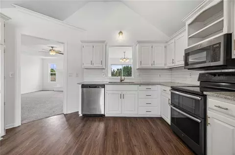 Kitchen - 712 S Sunset Ln, Raymore, MO 64083 photo 2 of 2