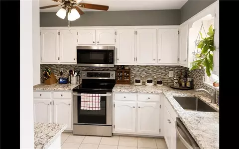 Kitchen - 506 S Monroe St, Raymore, MO 64083 photo 1 of 3