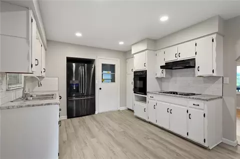 Kitchen - 705 NE Darwin St, Lees Summit, MO 64063 photo 2 of 2