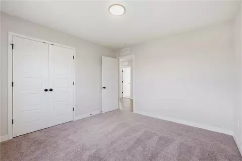 Bedroom - 413 Woodview Dr, Raymore, MO 64083 photo 6 of 9