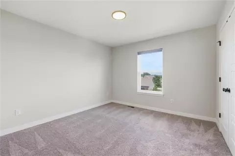 Bedroom - 413 Woodview Dr, Raymore, MO 64083 photo 5 of 9