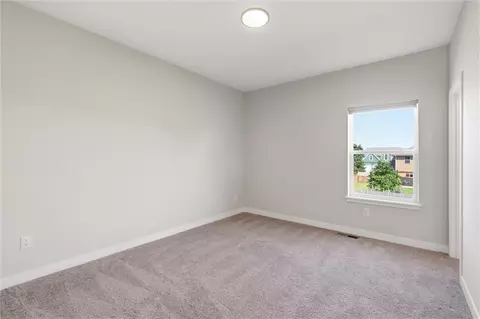 Bedroom - 413 Woodview Dr, Raymore, MO 64083 photo 8 of 9