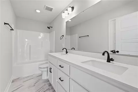 Bath - 413 Woodview Dr, Raymore, MO 64083 photo 4 of 5
