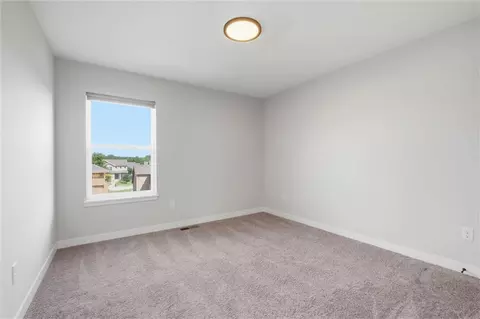 Bedroom - 413 Woodview Dr, Raymore, MO 64083 photo 3 of 9