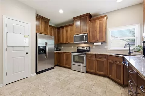 Kitchen - 308 E Olive St, Raymore, MO 64083 photo 2 of 4