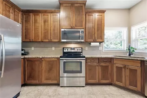 Kitchen - 308 E Olive St, Raymore, MO 64083 photo 3 of 4